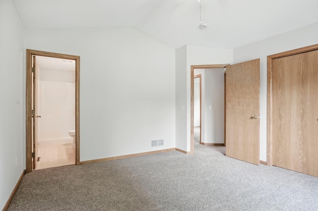 10310 Kaitlin Ave, Hanover, MN 55341 - unfurnished bedroom with carpet flooring, lofted ceiling, ensuite bathroom, a closet, and baseboards