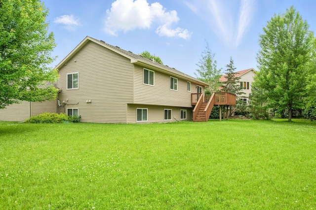 10310 Kaitlin Ave, Hanover, MN 55341 - back of house with stairs, a wooden deck, and a yard