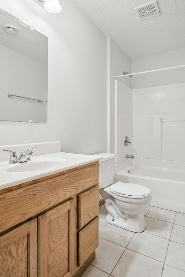 10310 Kaitlin Ave, Hanover, MN 55341 - full bathroom featuring vanity, shower / tub combination, toilet, tile patterned floors, and a textured ceiling