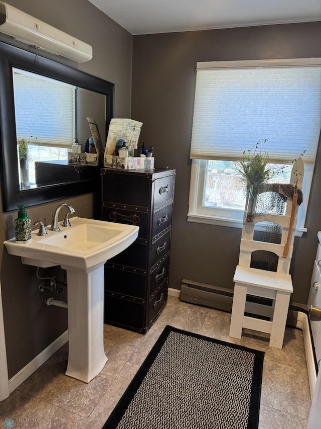 bathroom with baseboards