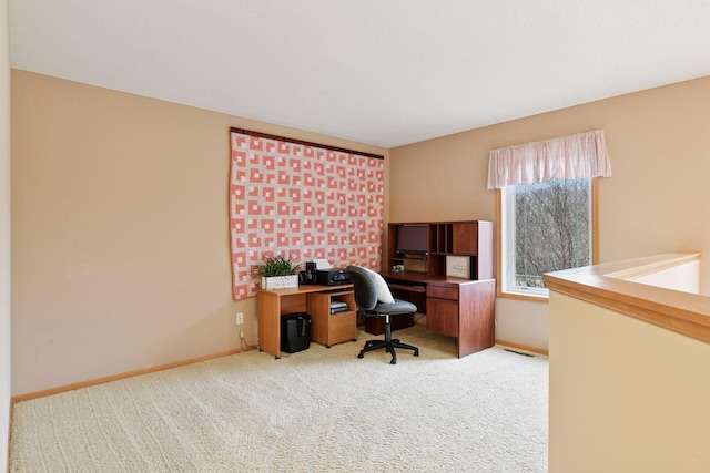 carpeted home office with baseboards and visible vents