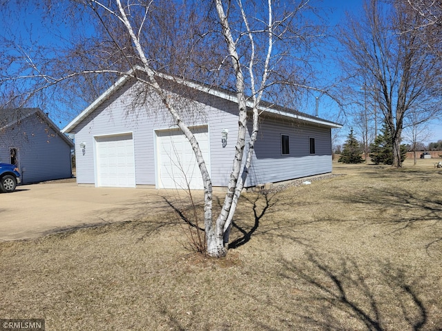 view of side of property featuring a garage