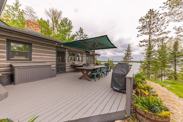 wooden terrace featuring outdoor dining space