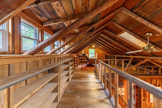attic featuring an upstairs landing