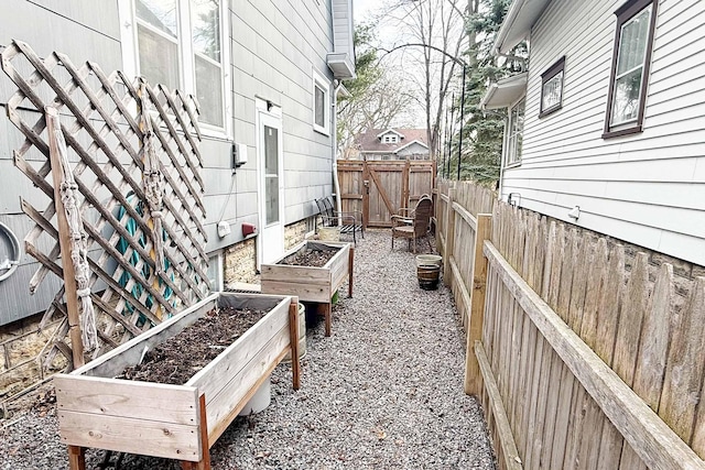 exterior space with a garden and fence