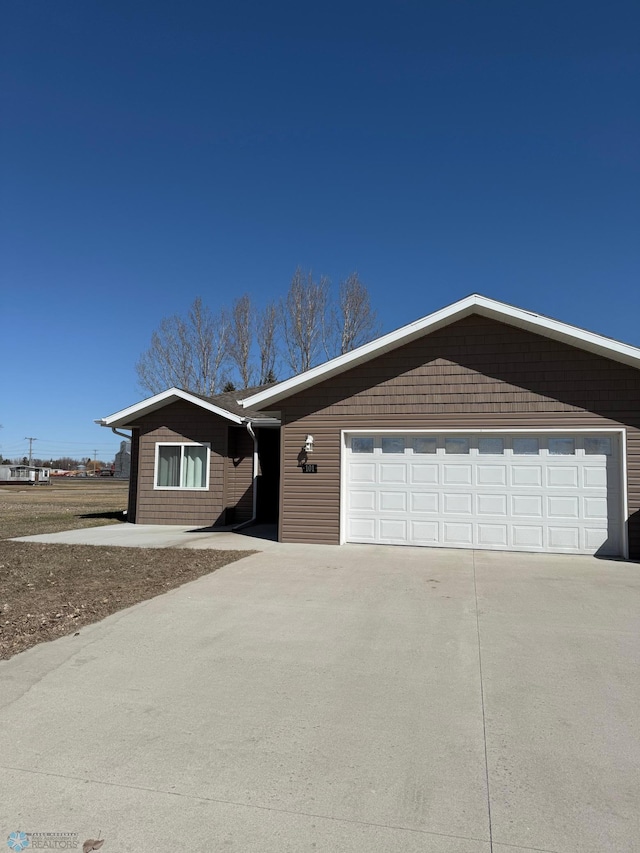 ranch-style home with a garage