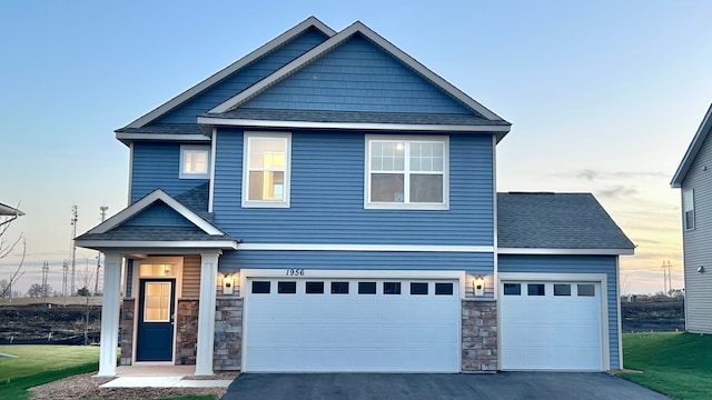 17026 Draper Way, Lakeville, MN 55044 - craftsman inspired home with stone siding, driveway, and roof with shingles