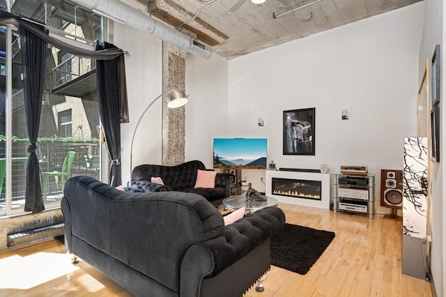 521 7th St Unit 311, Minneapolis, MN 55415 - living room with a glass covered fireplace and hardwood / wood-style floors