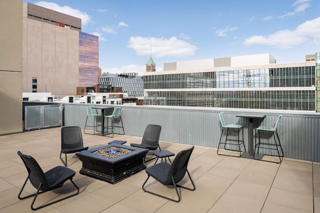 521 7th St Unit 311, Minneapolis, MN 55415 - view of patio / terrace with a view of city, an outdoor fire pit, and outdoor dry bar