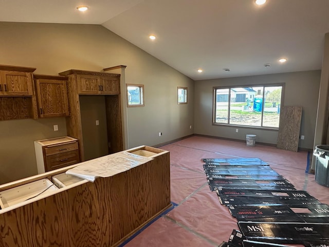 212 Woolgrass Way, Avon, MN 56310 - kitchen featuring light carpet, lofted ceiling, brown cabinets, recessed lighting, and baseboards
