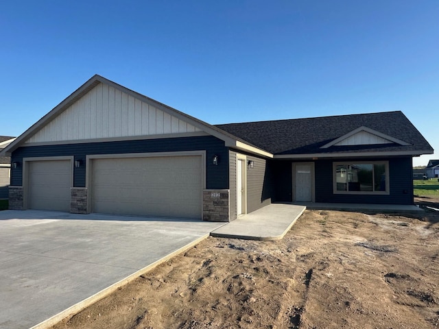 212 Woolgrass Way, Avon, MN 56310 - ranch-style home with a garage, driveway, board and batten siding, stone siding, and a shingled roof