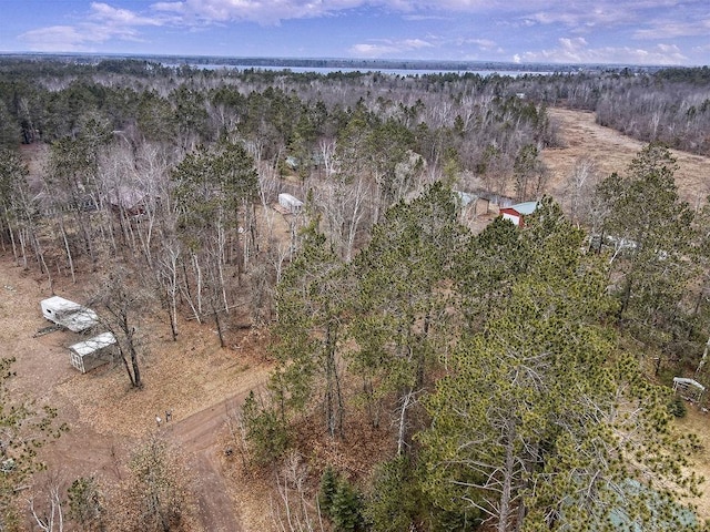 aerial view featuring a wooded view