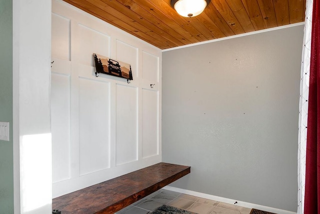 mudroom with wooden ceiling and baseboards