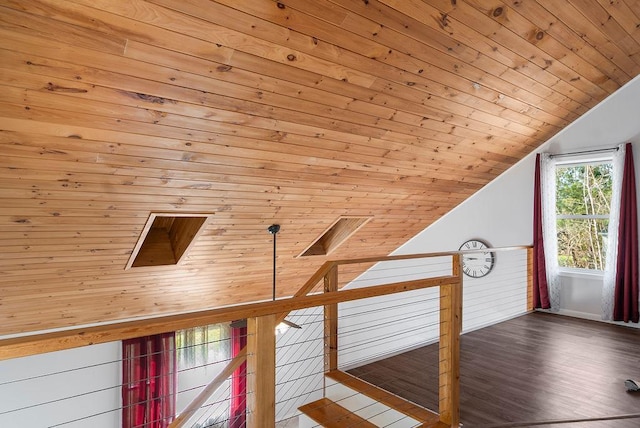 bonus room featuring baseboards, wood ceiling, wood finished floors, and vaulted ceiling