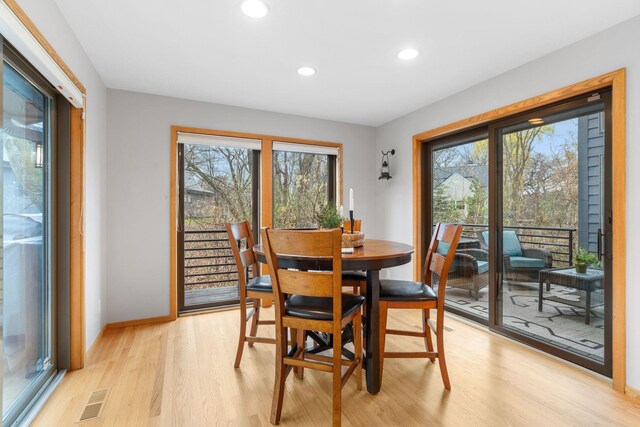 dining area with visible vents, recessed lighting, light wood-style flooring, and plenty of natural light
