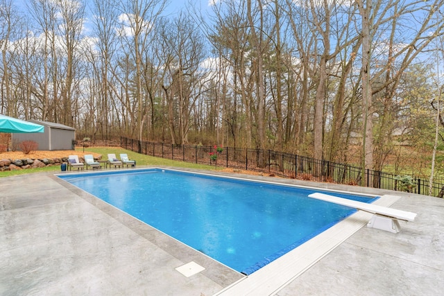 view of pool featuring a fenced in pool, a fenced backyard, and a patio area