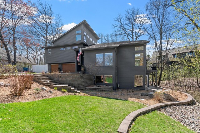 rear view of house with a yard