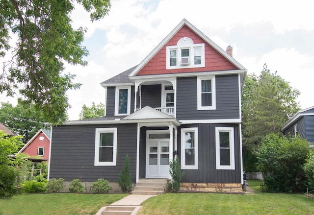 217 Center St, Mankato, MN 56001 - view of front of property featuring french doors, a chimney, and a front yard