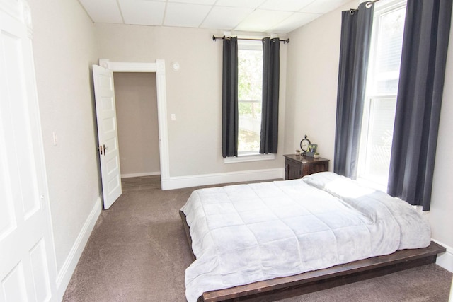 217 Center St, Mankato, MN 56001 - carpeted bedroom featuring a paneled ceiling and baseboards