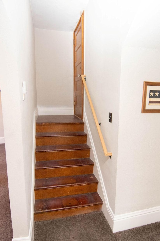 217 Center St, Mankato, MN 56001 - stairway with baseboards and carpet floors