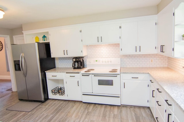217 Center St, Mankato, MN 56001 - kitchen featuring white cabinetry, range with two ovens, open shelves, and stainless steel fridge