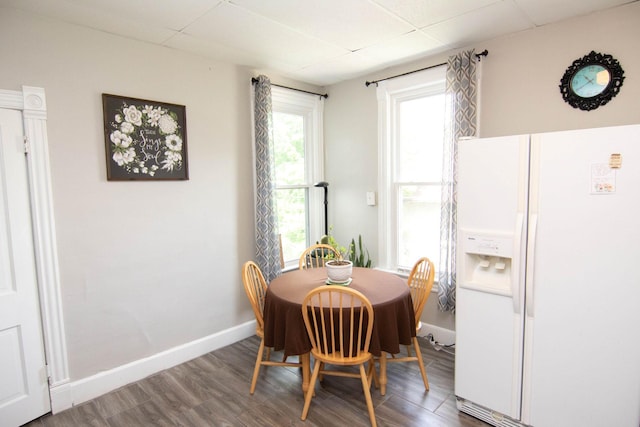 217 Center St, Mankato, MN 56001 - dining space featuring a drop ceiling, baseboards, and wood finished floors