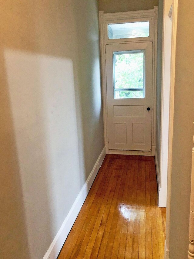 217 Center St, Mankato, MN 56001 - doorway with hardwood / wood-style floors and baseboards