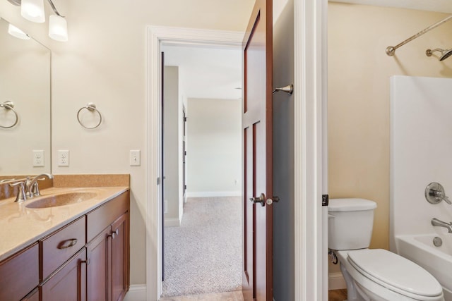 full bath featuring toilet, vanity, and  shower combination