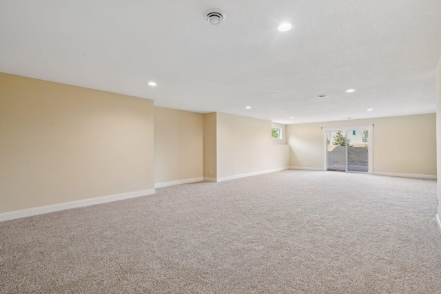 carpeted spare room with recessed lighting and baseboards