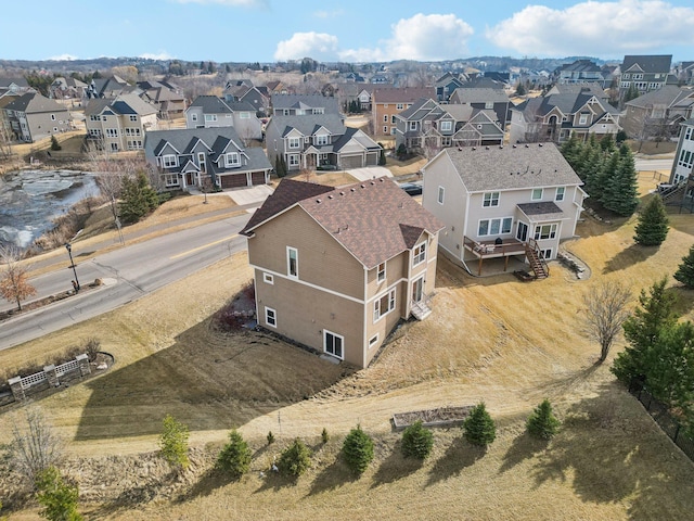 birds eye view of property with a residential view