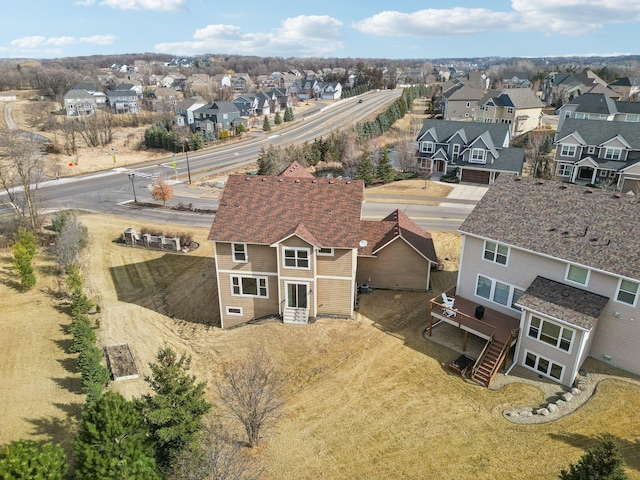 birds eye view of property with a residential view