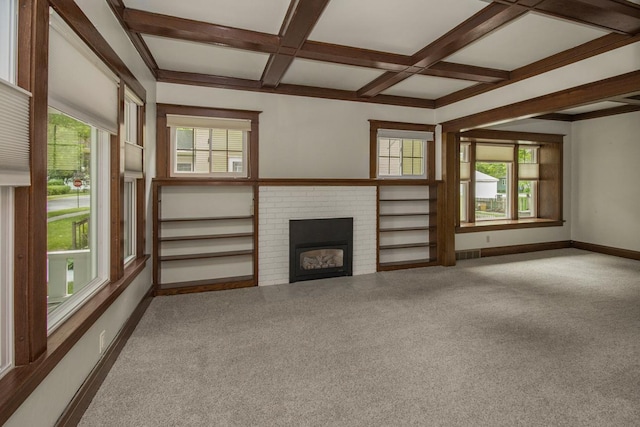 509 Nicollet Ave, North Mankato, MN 56003 - unfurnished living room with carpet, coffered ceiling, healthy amount of natural light, a brick fireplace, and beamed ceiling