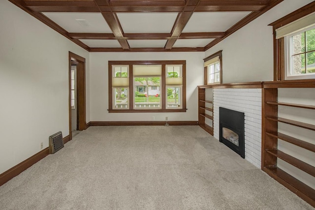 509 Nicollet Ave, North Mankato, MN 56003 - unfurnished living room with light carpet, a brick fireplace, beam ceiling, coffered ceiling, and baseboards