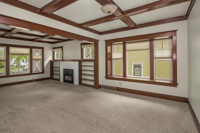 509 Nicollet Ave, North Mankato, MN 56003 - unfurnished living room with coffered ceiling, carpet, a brick fireplace, baseboards, and beamed ceiling