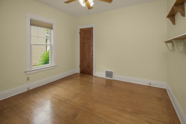509 Nicollet Ave, North Mankato, MN 56003 - empty room with ceiling fan, wood-type flooring, and baseboards