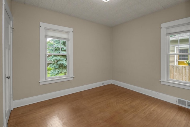 509 Nicollet Ave, North Mankato, MN 56003 - empty room featuring wood finished floors and baseboards