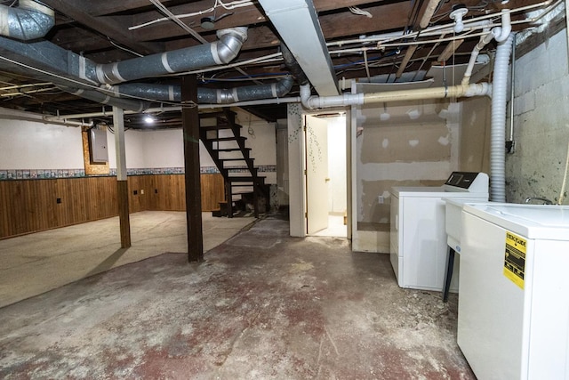 509 Nicollet Ave, North Mankato, MN 56003 - unfinished below grade area with washing machine and dryer, stairs, electric panel, and wood walls