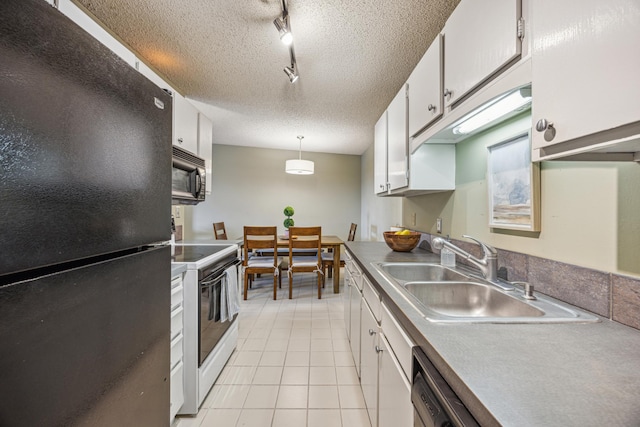 210 Grant St Unit 710, Minneapolis, MN 55403 - kitchen with rail lighting, white cabinetry, a sink, black appliances, and light tile patterned flooring