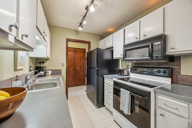 210 Grant St Unit 710, Minneapolis, MN 55403 - kitchen with a sink, light tile patterned floors, white cabinets, track lighting, and black appliances