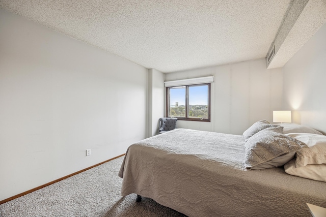 210 Grant St Unit 710, Minneapolis, MN 55403 - bedroom featuring baseboards, carpet, a textured ceiling, and visible vents