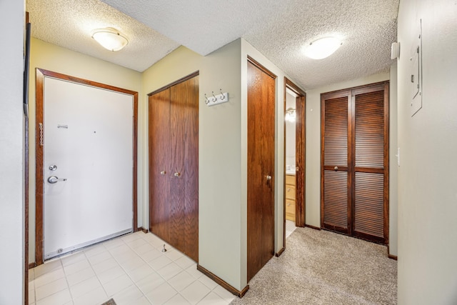 210 Grant St Unit 710, Minneapolis, MN 55403 - corridor featuring baseboards and a textured ceiling