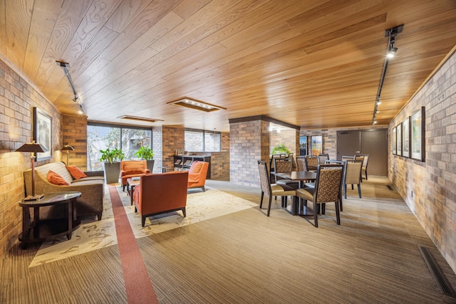 210 Grant St Unit 710, Minneapolis, MN 55403 - living room with brick wall, visible vents, wooden ceiling, and rail lighting