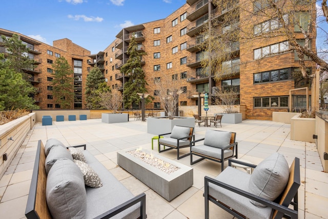 210 Grant St Unit 710, Minneapolis, MN 55403 - view of patio / terrace featuring an outdoor living space with a fire pit