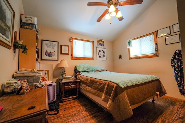 5242 Cusson Loop Rd, Leiding Twp, MN 55771 - bedroom with dark wood-style flooring, multiple windows, lofted ceiling, and ceiling fan