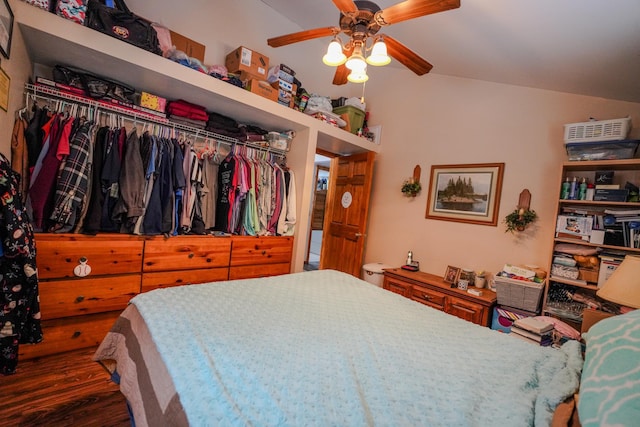 5242 Cusson Loop Rd, Leiding Twp, MN 55771 - bedroom with wood finished floors, lofted ceiling, a ceiling fan, and a closet