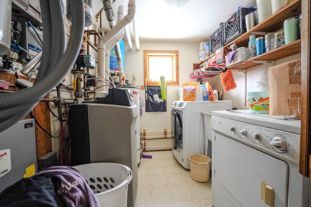 5242 Cusson Loop Rd, Leiding Twp, MN 55771 - laundry room featuring washer and dryer and light floors
