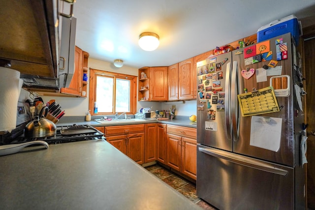 5242 Cusson Loop Rd, Leiding Twp, MN 55771 - kitchen with freestanding refrigerator, open shelves, and brown cabinetry