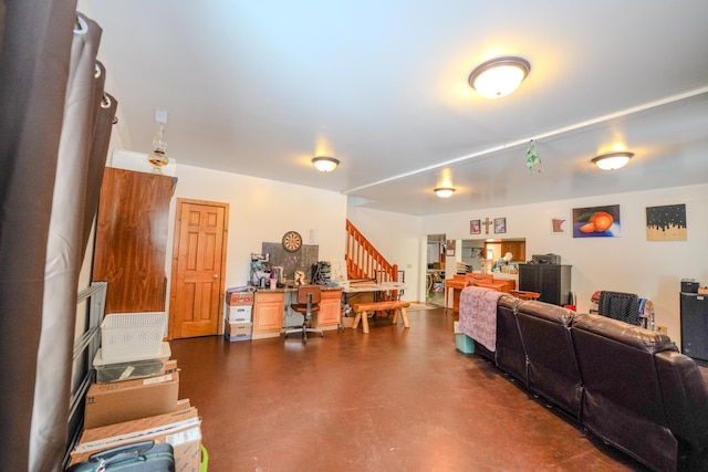 5242 Cusson Loop Rd, Leiding Twp, MN 55771 - living room with finished concrete floors and stairway