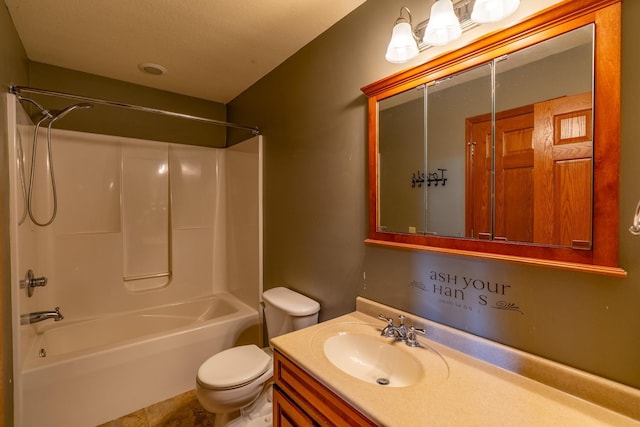 bathroom featuring toilet, vanity, and shower / tub combination