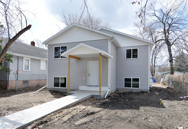 view of front of property featuring fence